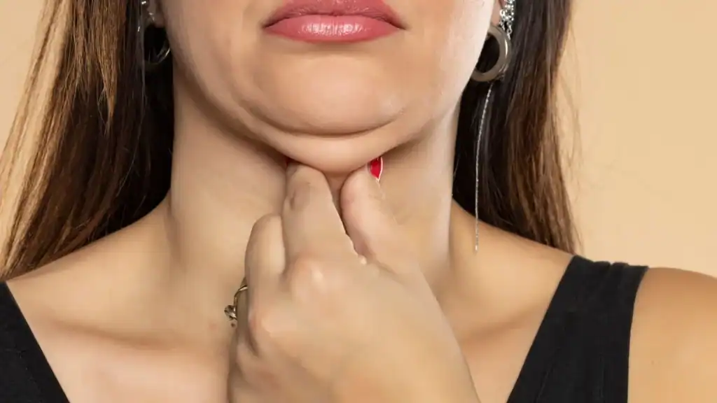 An image of a woman with double chin, sad, worried : Non Surgical Double Chin Removal Treatment in Romford, UK